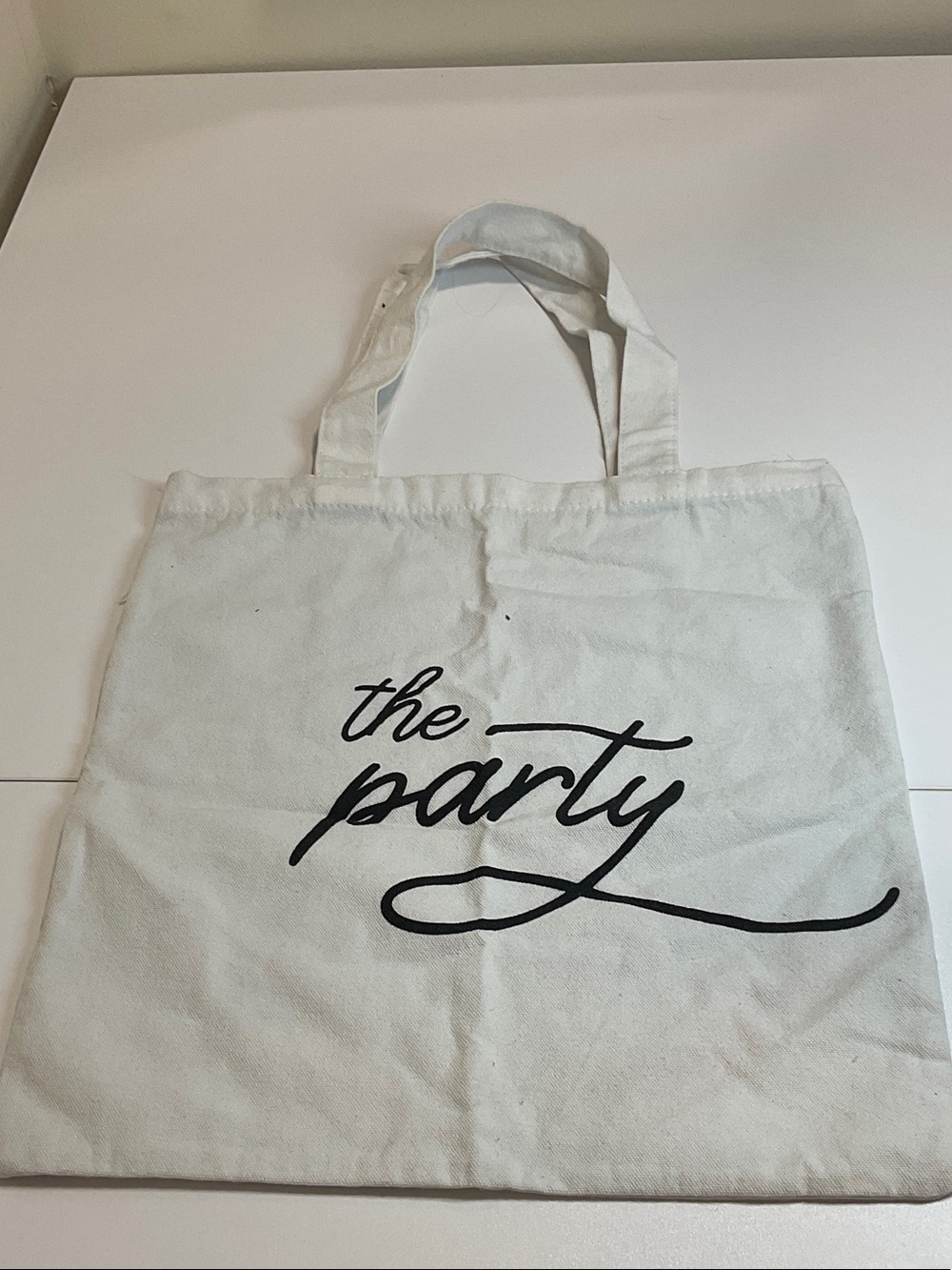 Reusable White Canvas Tote Bag with Black Script - The Party